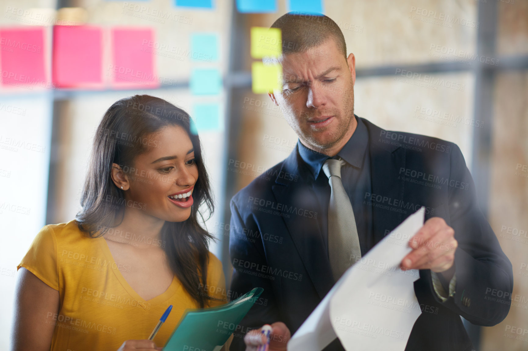 Buy stock photo Cropped shot of two businesspeople working in the office