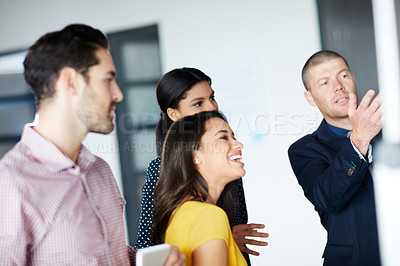 Buy stock photo Cropped shot of four businesspeople working in the office
