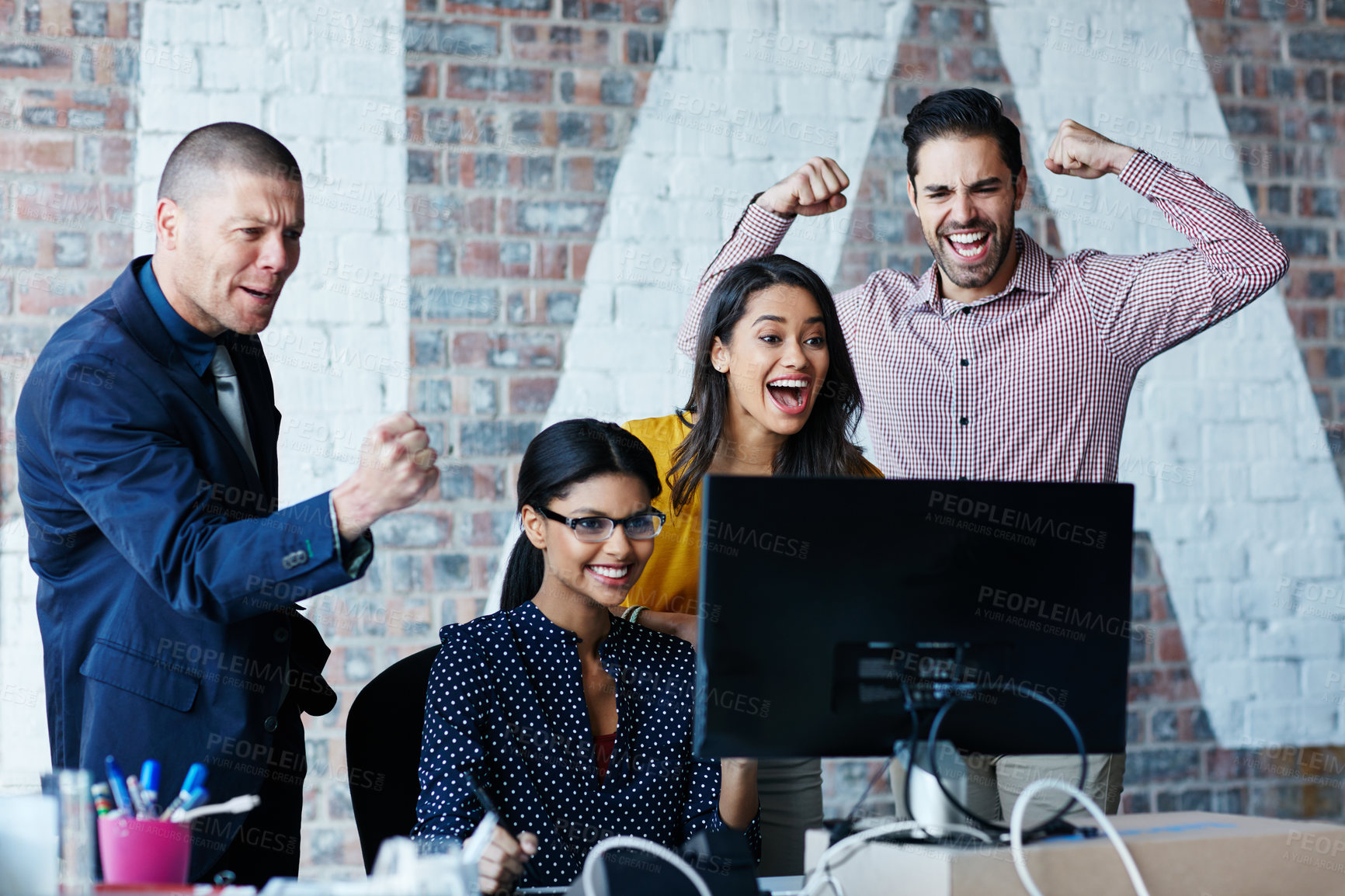 Buy stock photo Cropped shot of four businesspeople cheering in the office