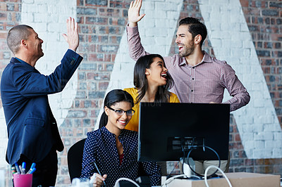 Buy stock photo Cropped shot of four businesspeople cheering in the office