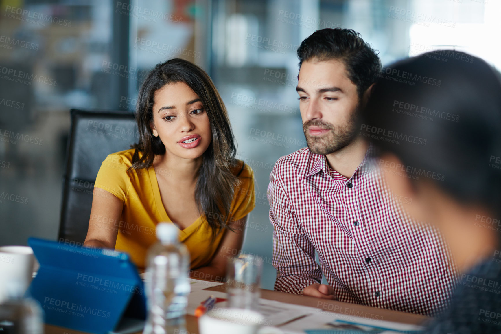 Buy stock photo Shot of a group of colleagues having a meeting in a boardroom