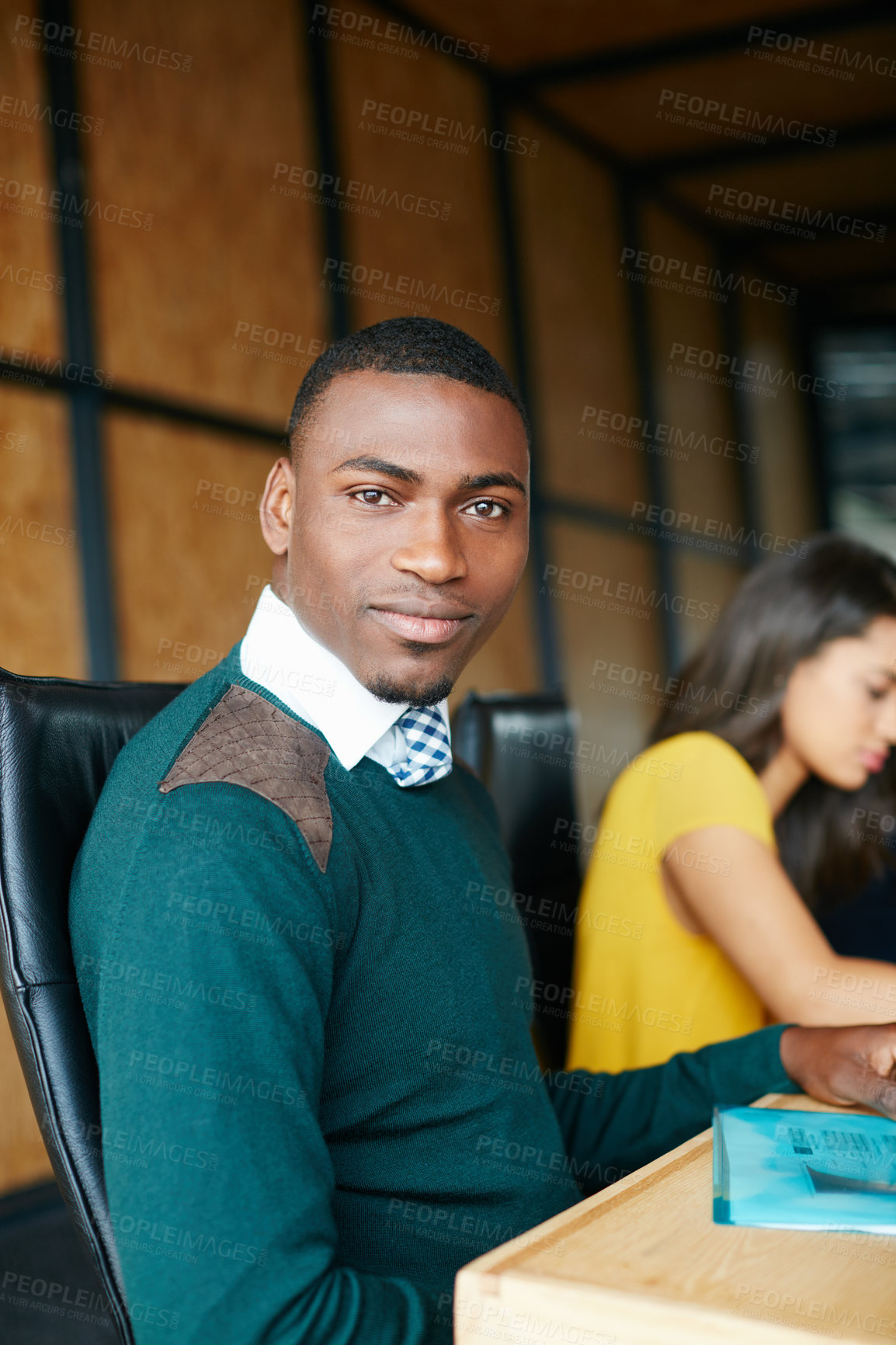 Buy stock photo Portrait of an office worker in a meeting with colleagues in the background