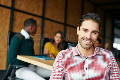 Buy stock photo Portrait of an office worker in a meeting with colleagues in the background