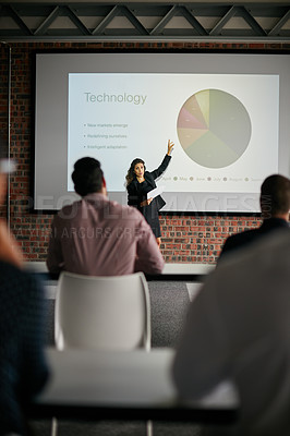 Buy stock photo Shot of a businesswoman giving a presentation to her colleagues