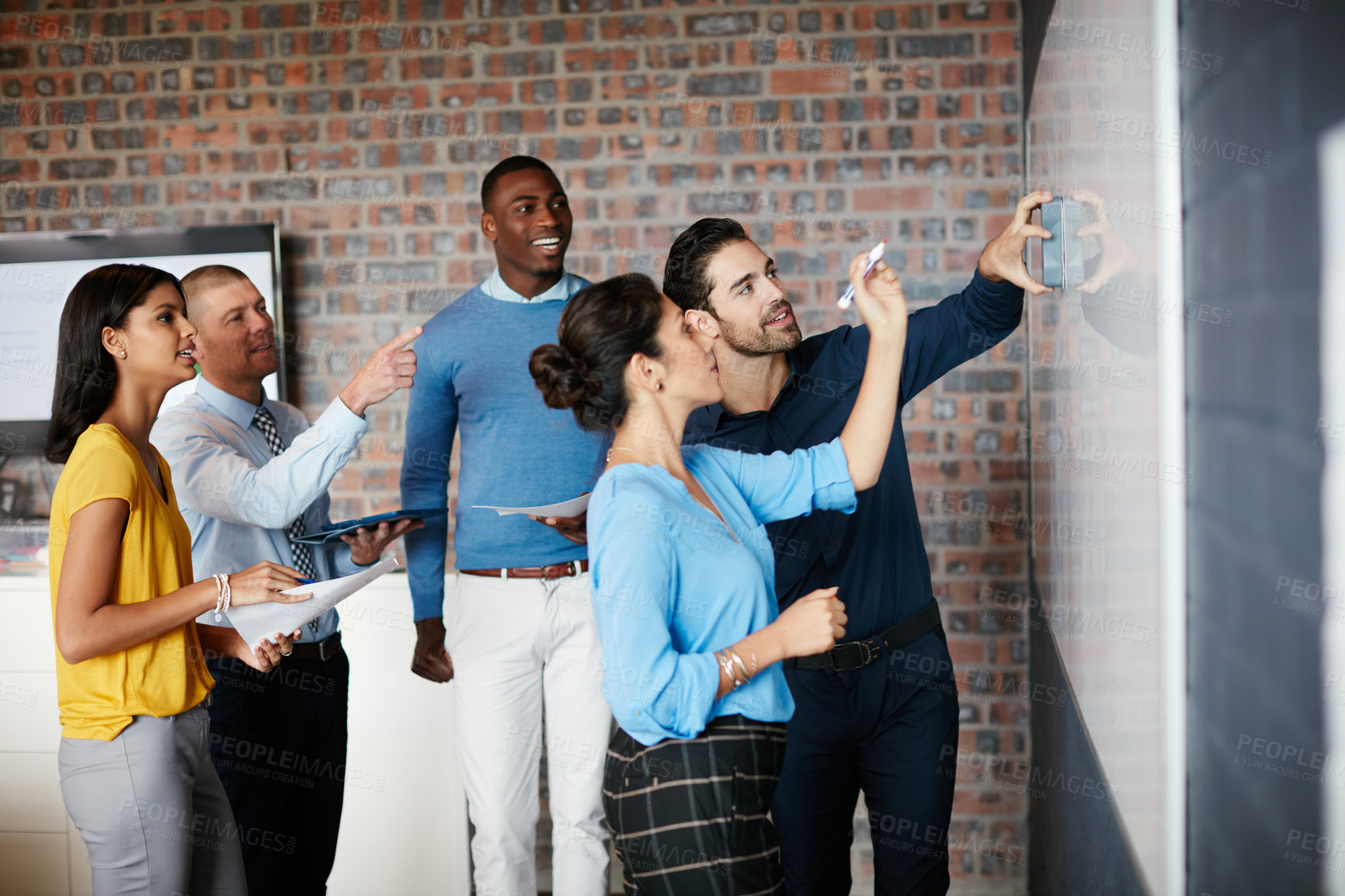 Buy stock photo Cropped shot of a group of businesspeople in the boardroom