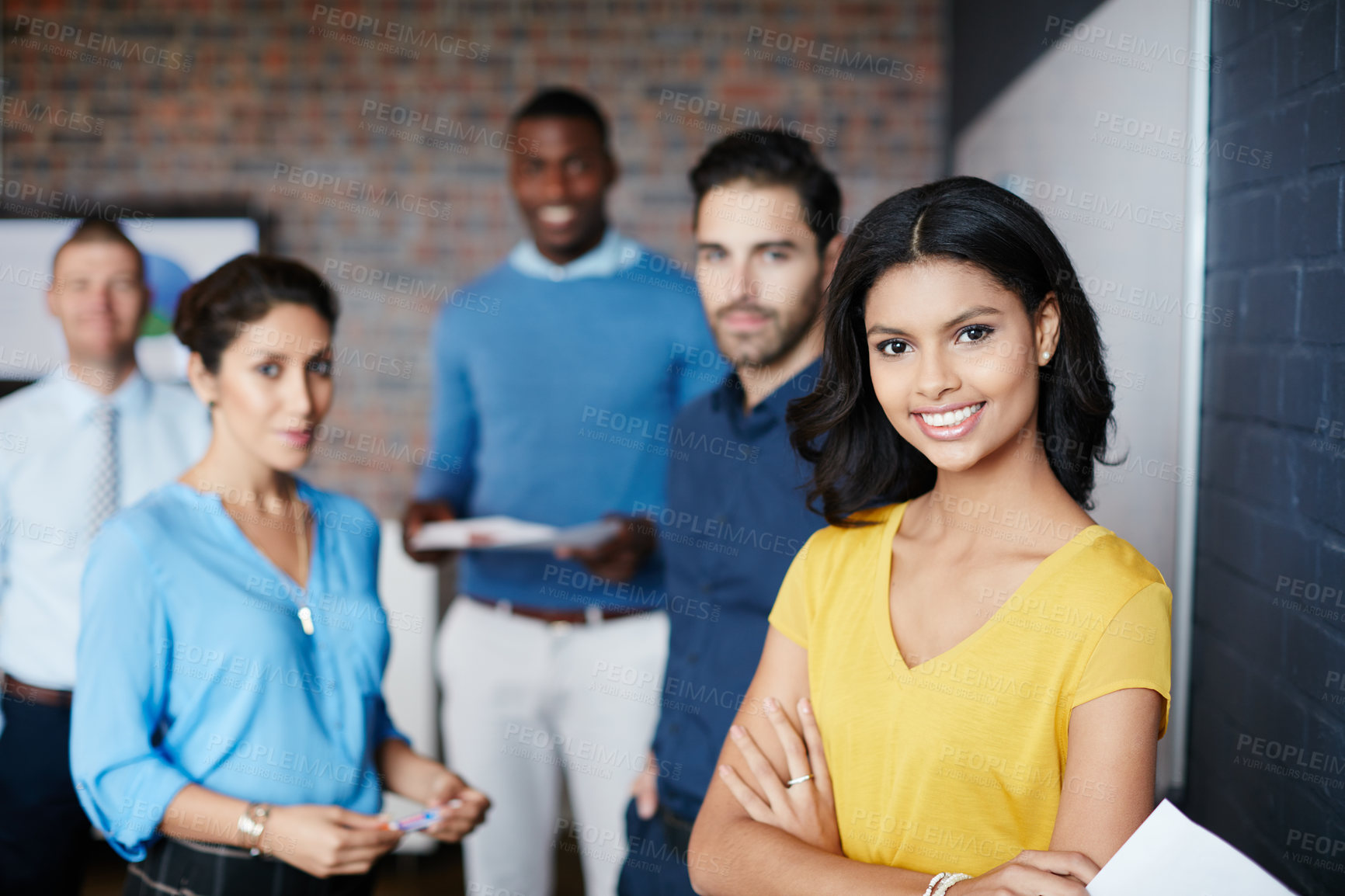 Buy stock photo Cropped portrait of a group of businesspeople standing in the workplace