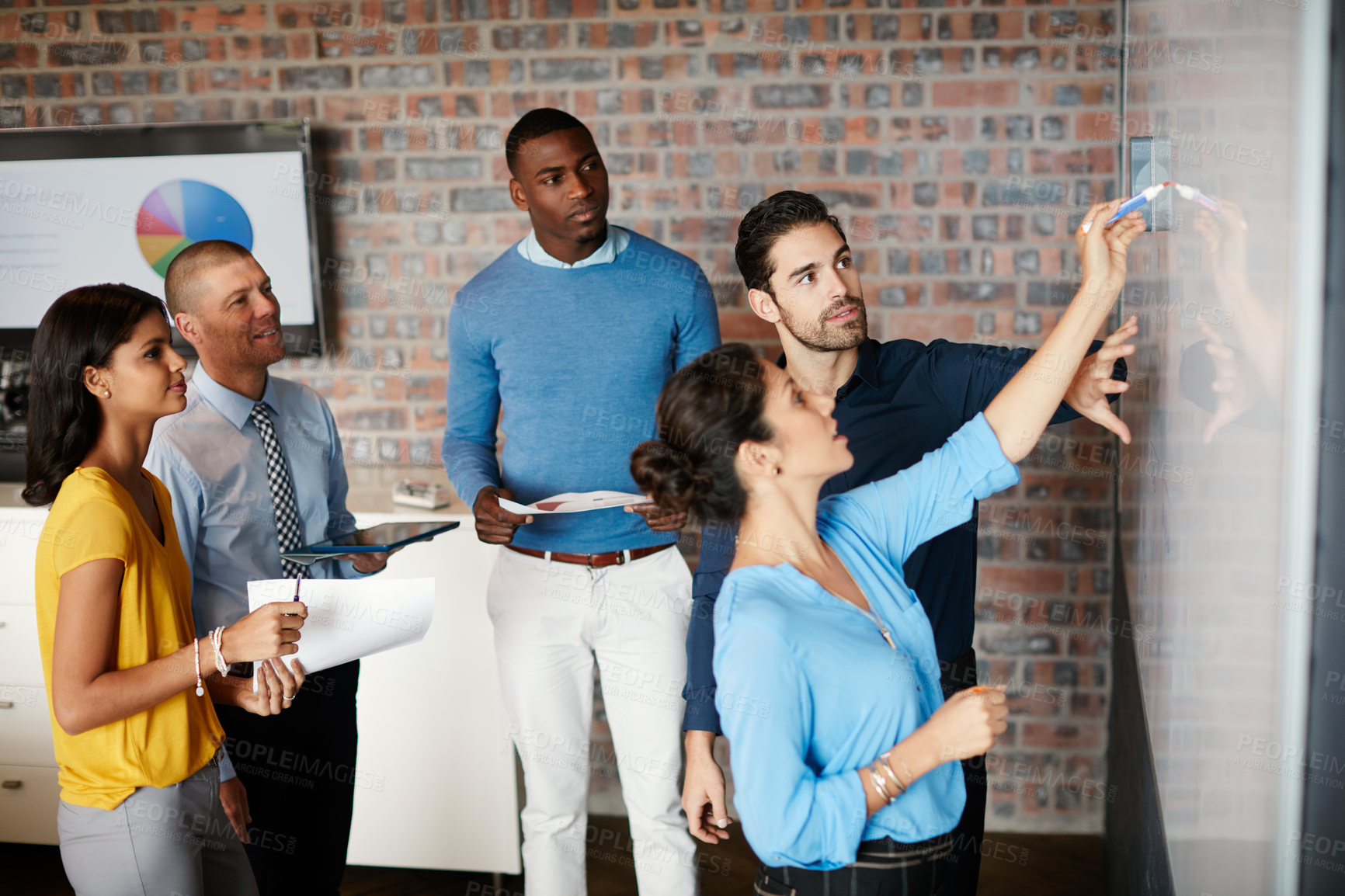 Buy stock photo Cropped shot of a group of businesspeople in the boardroom