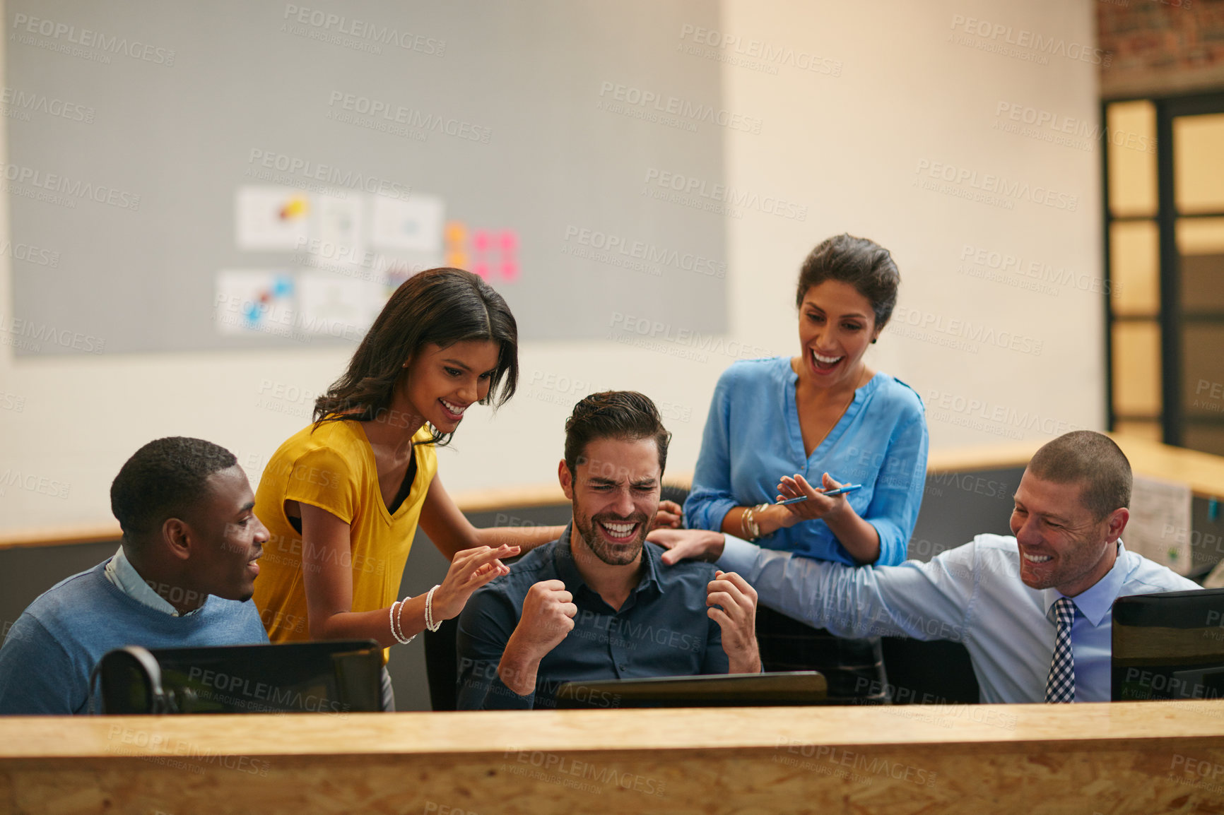 Buy stock photo Cropped shot of a group of creative professionals cheering in the office