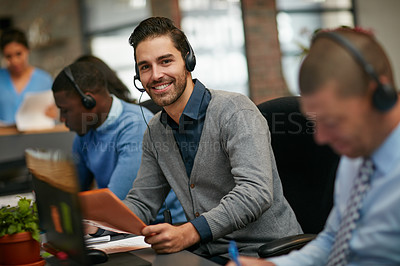 Buy stock photo Cropped portrait of a businessman working in the office with his colleagues