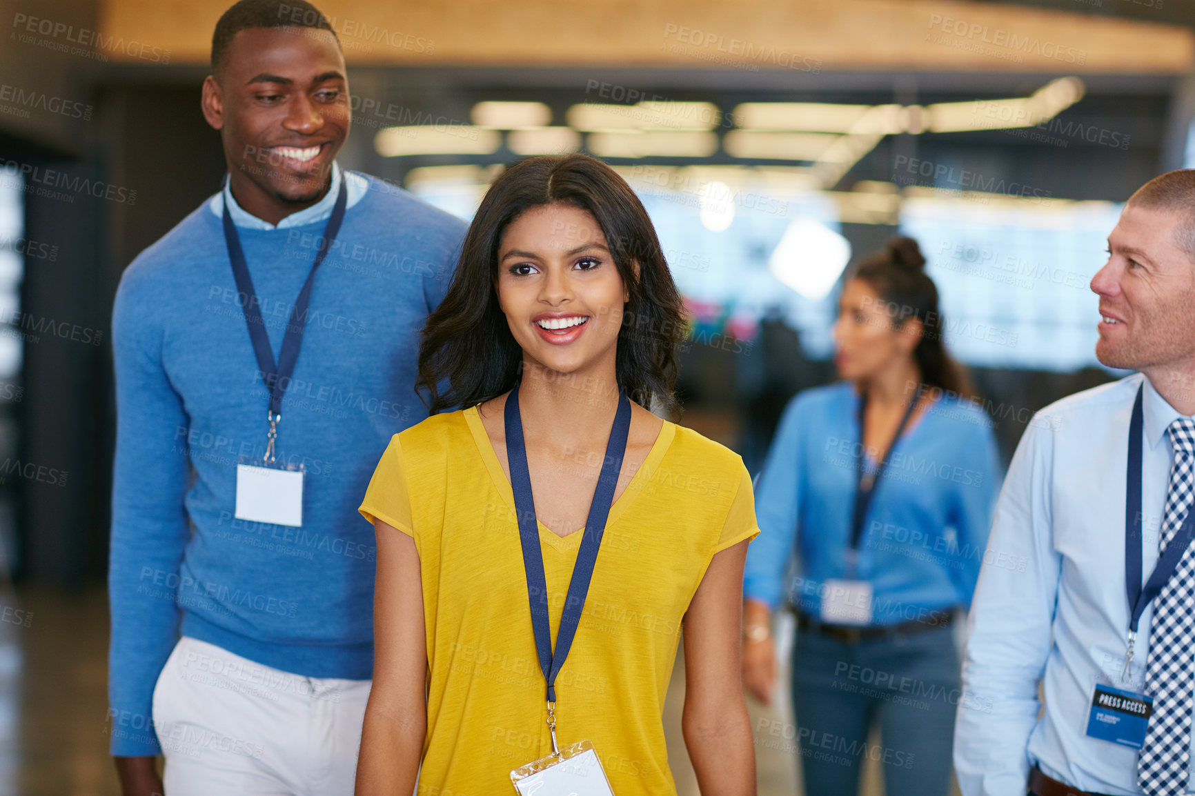 Buy stock photo Business, people and walking with smile in office for teamwork, press conference or media coverage. Journalist, staff or happiness with ID badge for seminar, interview preparation and tradeshow event