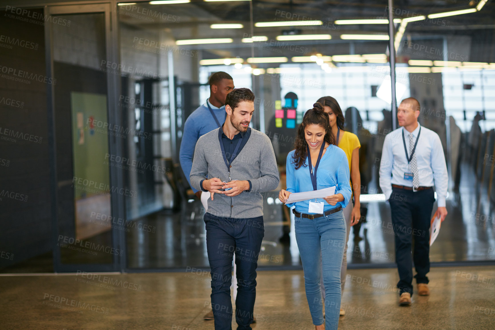 Buy stock photo Cropped shot of a group of businesspeople walking into work