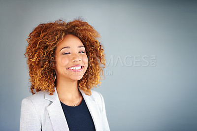Buy stock photo Studio shot of a young businesswoman against a gray background