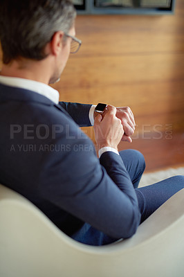 Buy stock photo Check, smart watch or businessman in office for appointment, meeting or notification alert. Back view, time management or applicant in waiting room for interview feedback, schedule or accountability