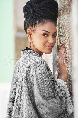 Buy stock photo Portrait of a fashionable young woman posing against a wall