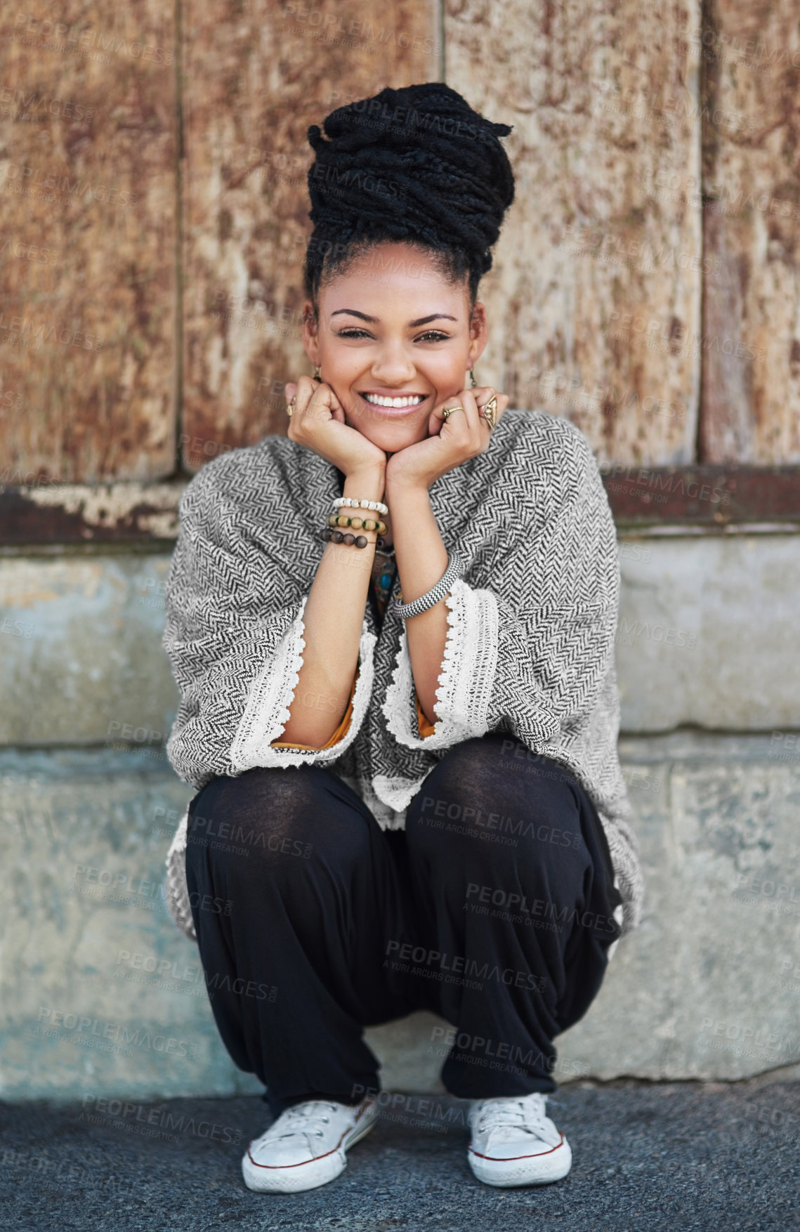 Buy stock photo Full length shot of a fashionable young woman sitting outside