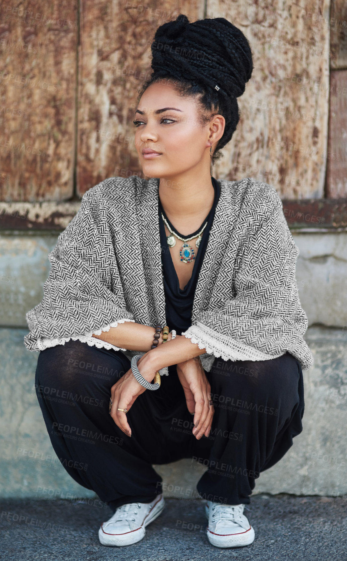 Buy stock photo Full length shot of a fashionable young woman sitting outside