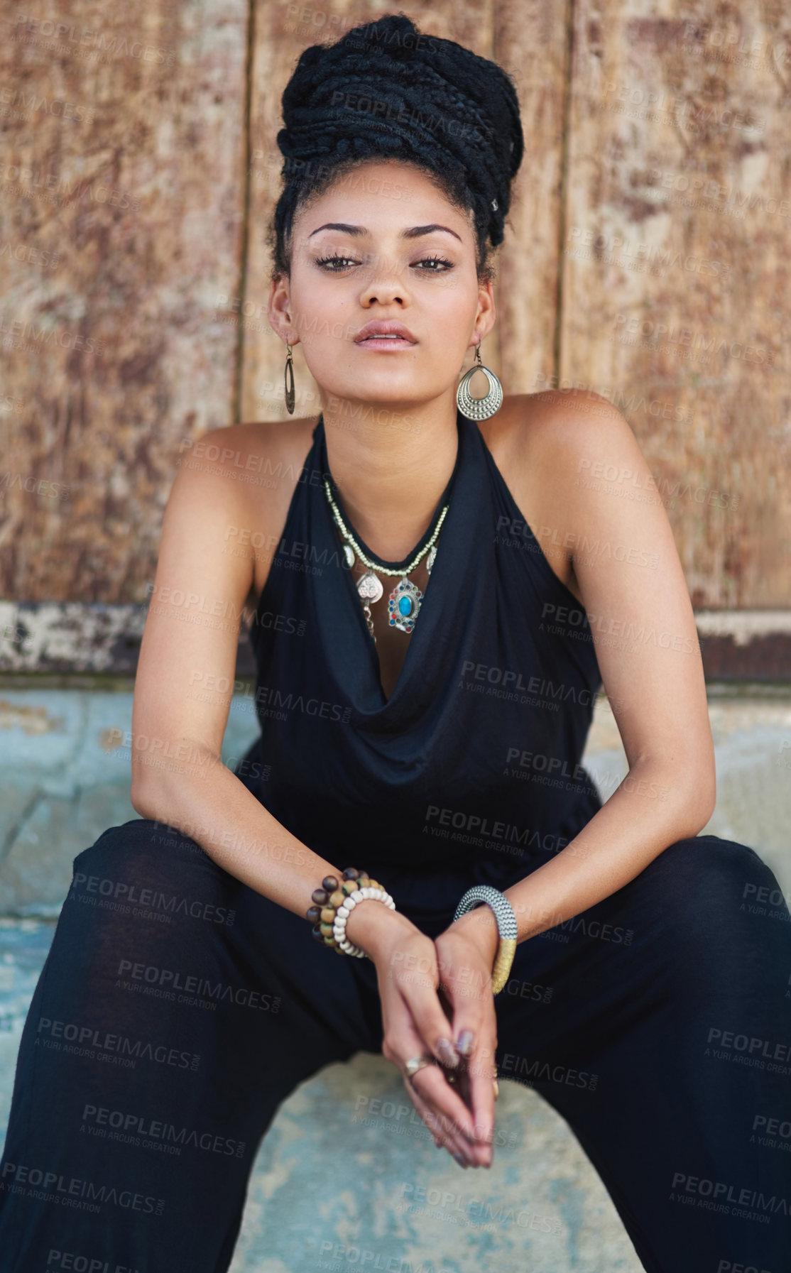 Buy stock photo Portrait, outdoor or confident African woman with fashion, dreadlocks or bangles by wall in urban town alone. Stylist, hairdresser and proud natural model with elegant necklace for culture in Jamaica