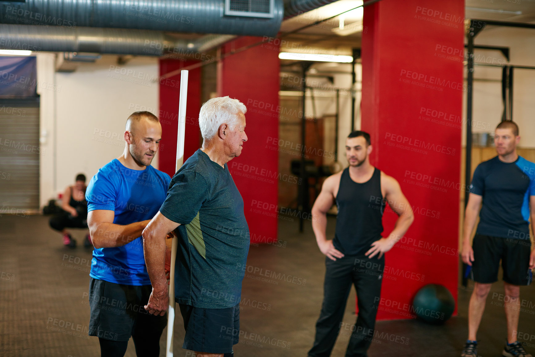 Buy stock photo Shot of a senior man doing pvc pipe exercises with the assistance of his trainer