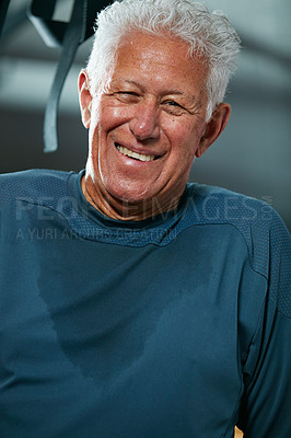 Buy stock photo Cropped shot of a senior man working out in the gym