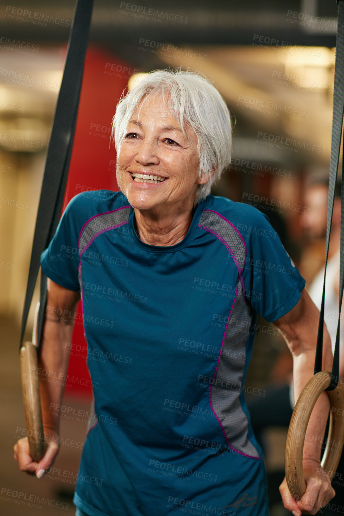 Buy stock photo Cropped shot of a senior woman working out in the gym