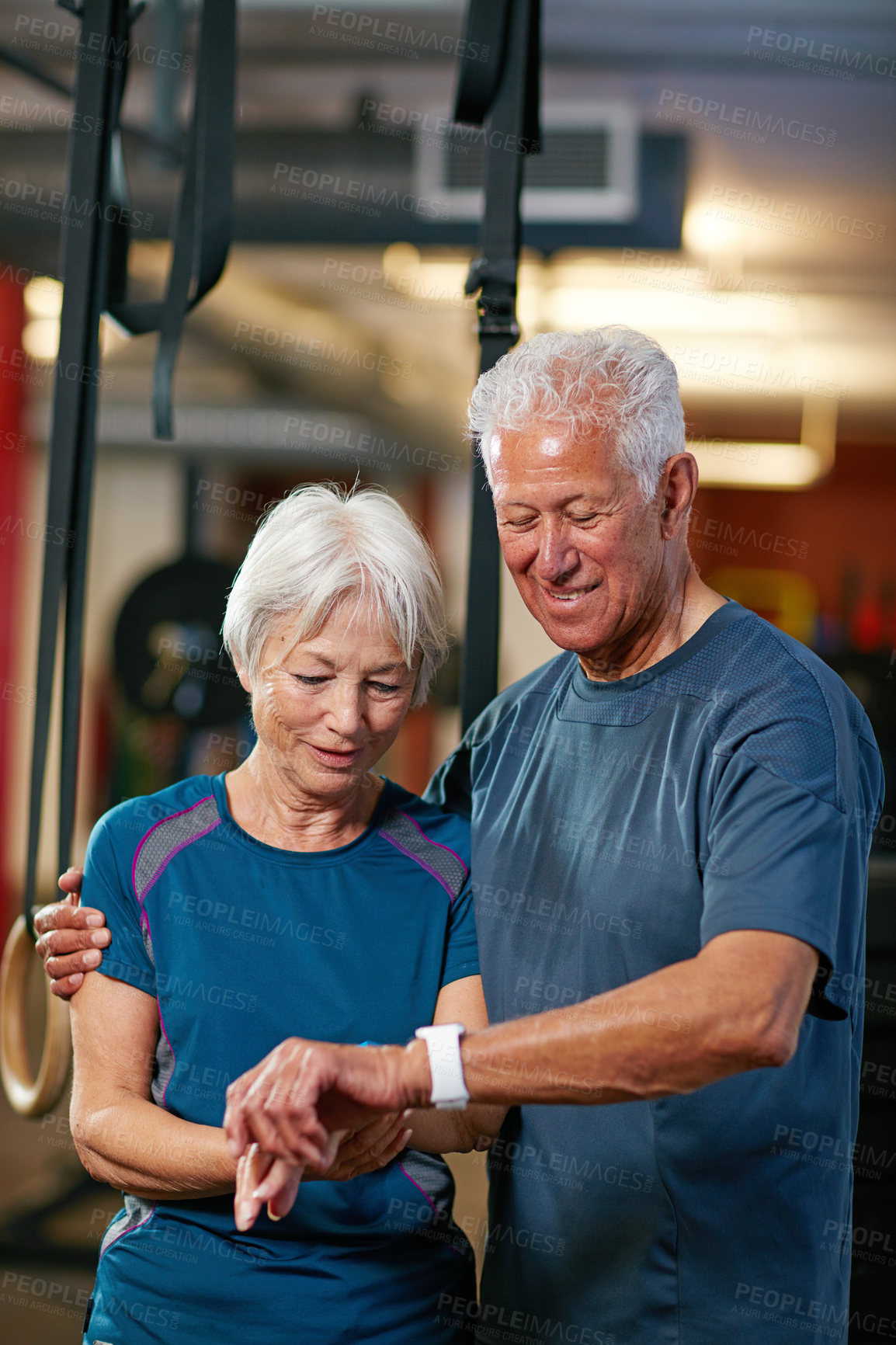 Buy stock photo Cropped shot of a senior couple working out in the gym