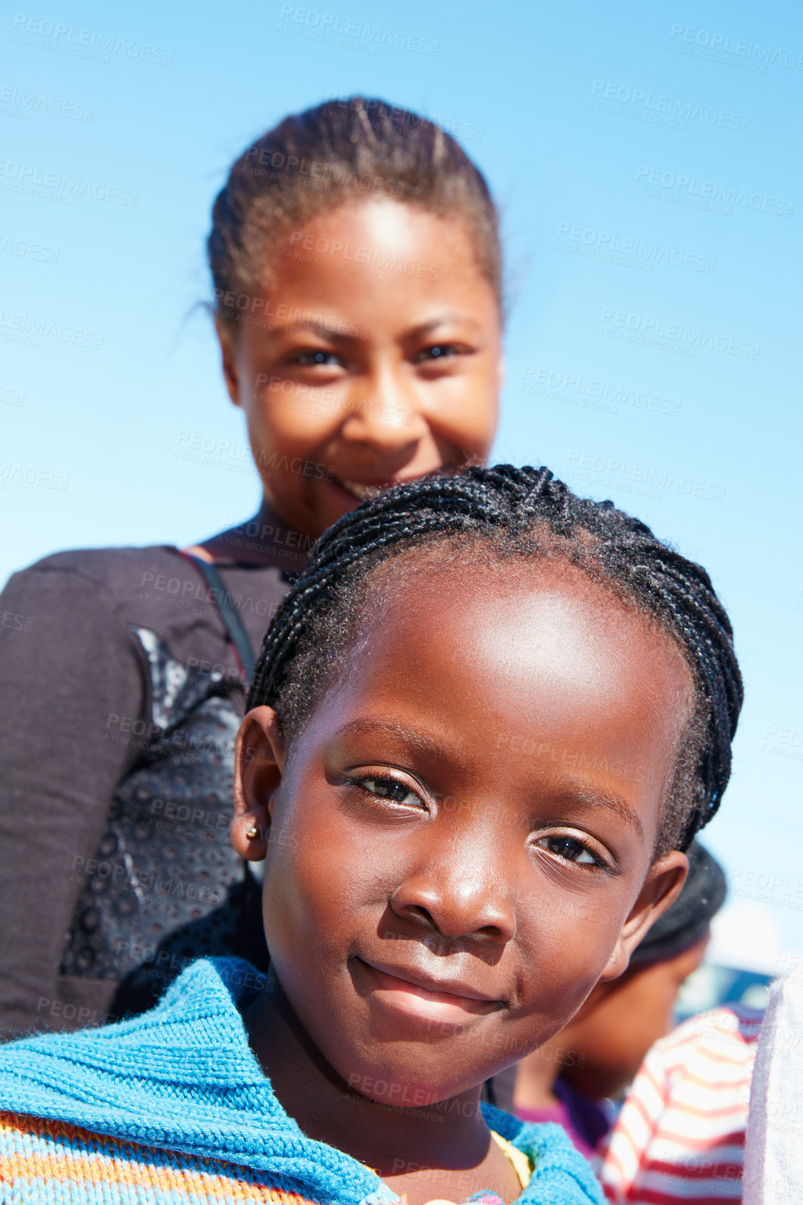 Buy stock photo Cropped portrait of two young children at a community outreach event