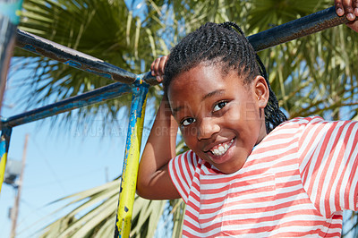 Buy stock photo Portrait of a happy little girl playing on a jungle gym
