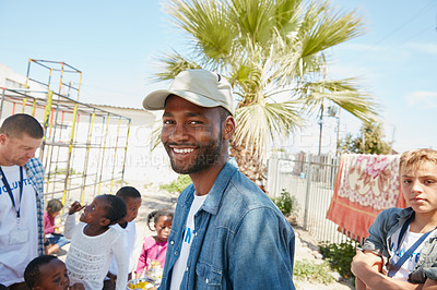 Buy stock photo Cropped portrait of a young man volunteering at a community outreach