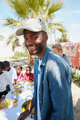 Buy stock photo Cropped portrait of a young man volunteering at a community outreach