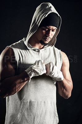 Buy stock photo Cropped shot of an athletic young man against a dark background