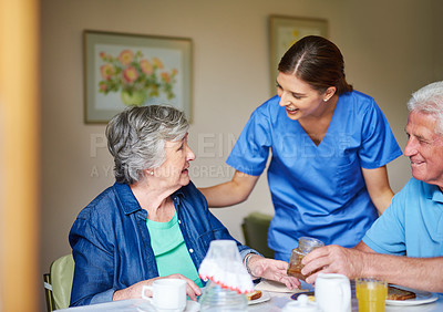 Buy stock photo Shot of two residents and a nurse at a retirement home