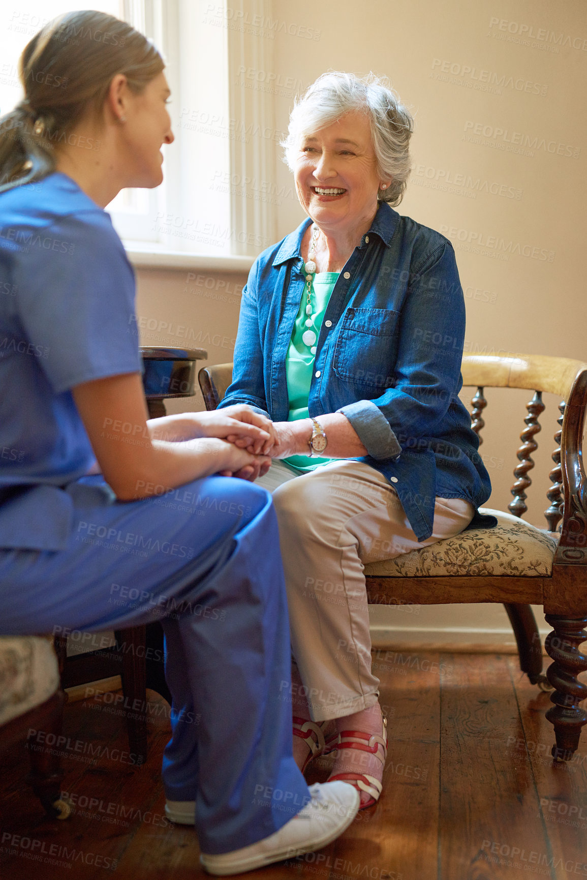 Buy stock photo Shot of a resident being consoled by a nurse in a retirement home