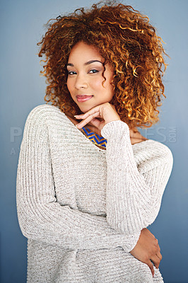 Buy stock photo Studio shot of a young woman posing against a grey background