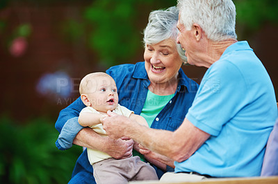 Buy stock photo Cropped shot of a senior couple spending time with their grandson