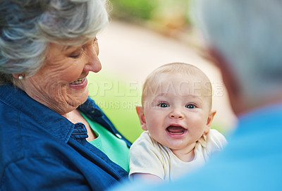 Buy stock photo Cropped shot of a baby boy spending time outdoors with his grandmother