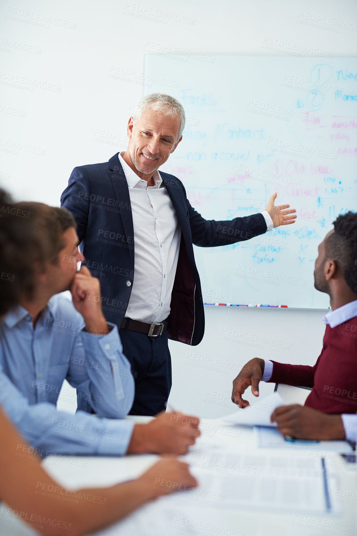 Buy stock photo Cropped shot of a mature businessman giving a presentation in the boardroom