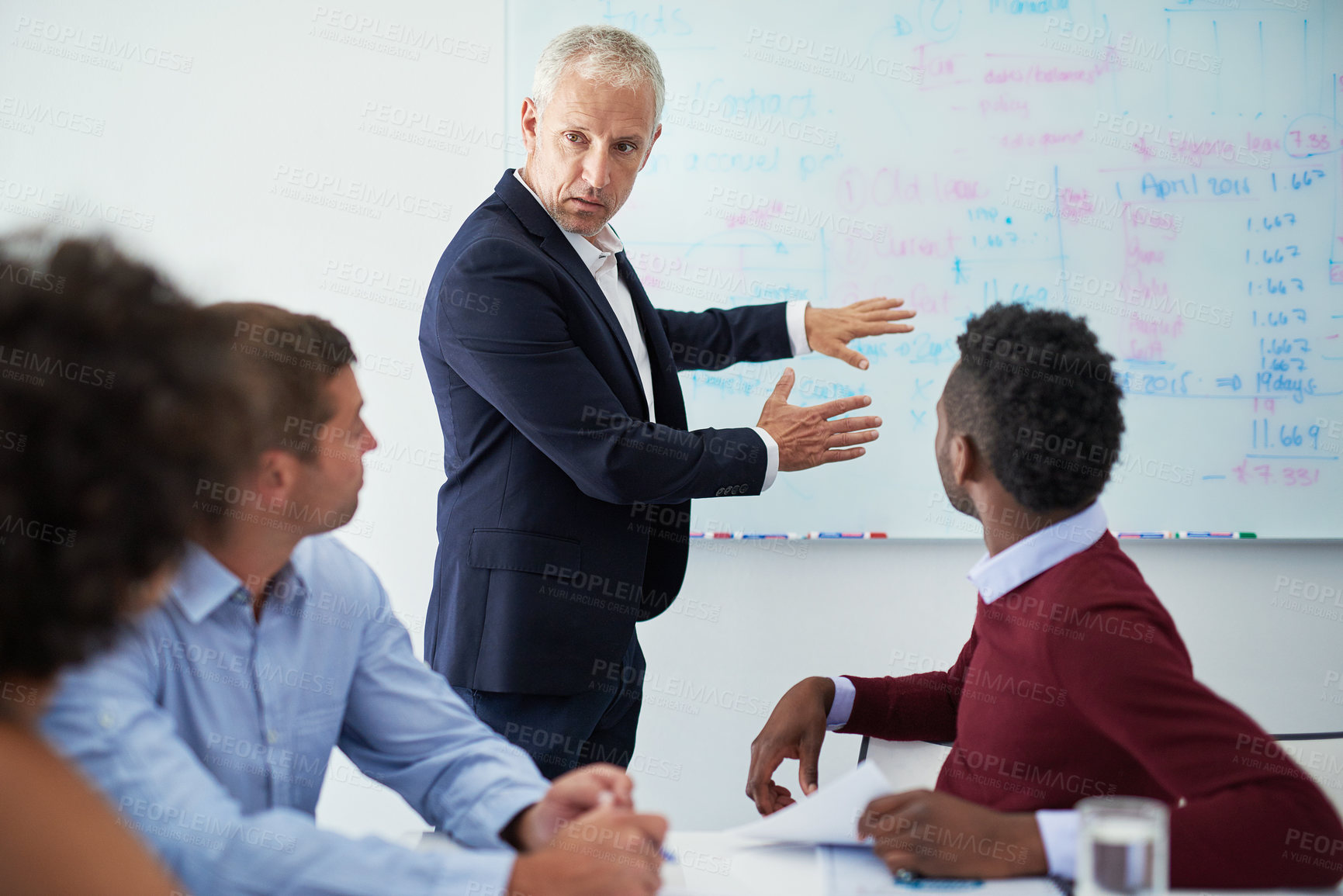 Buy stock photo Cropped shot of a mature businessman giving a presentation in the boardroom