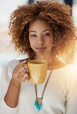 Buy stock photo Portrait of a young woman drinking a cup of coffee