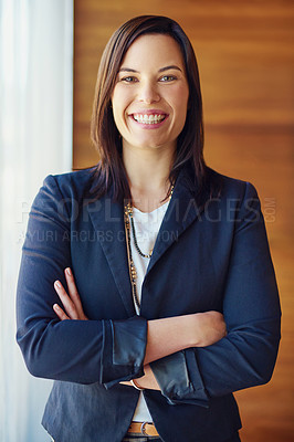 Buy stock photo Portrait of a confident businesswoman standing in her office