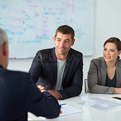 Buy stock photo Shot of a businessman shaking hands with a colleague in a meeting