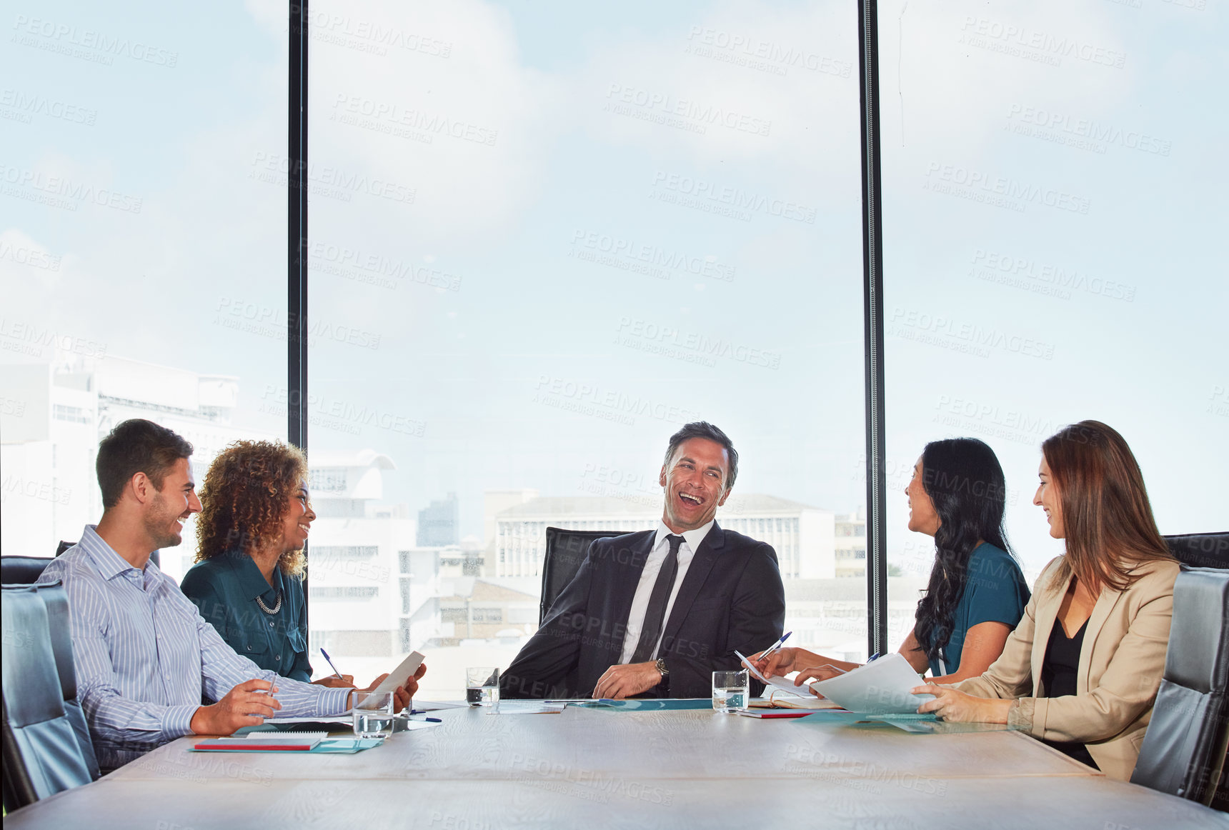 Buy stock photo Shot of a group of businesspeople in a meeting