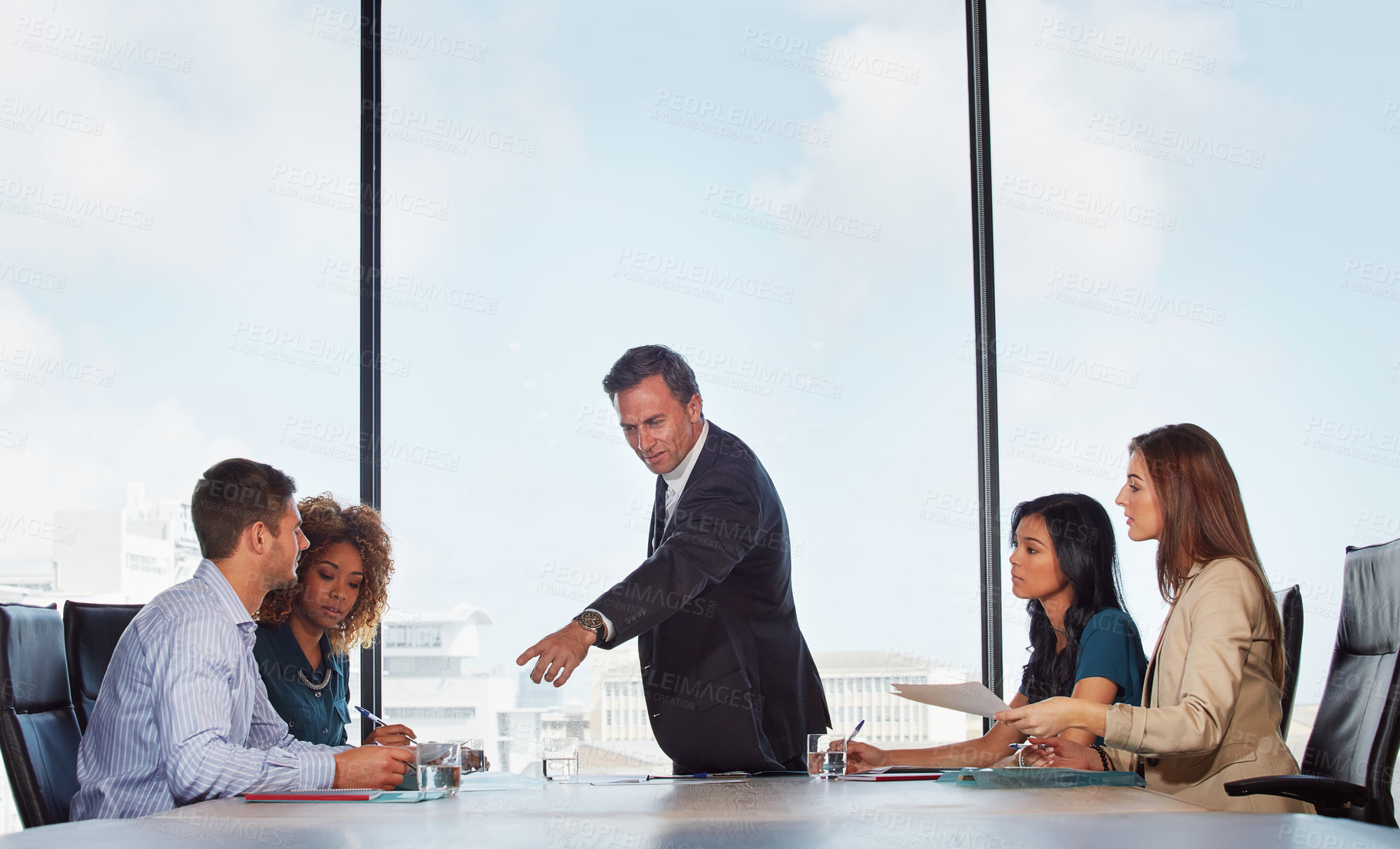 Buy stock photo Shot of a group of businesspeople in a meeting