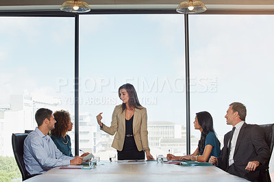 Buy stock photo Shot of a group of businesspeople in a meeting