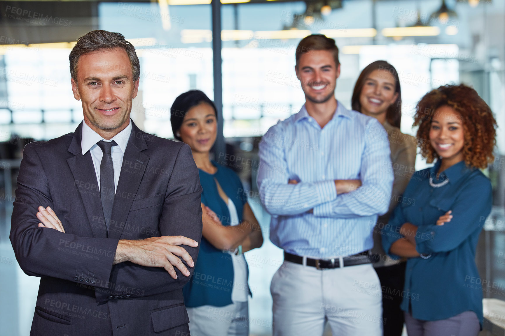 Buy stock photo Portrait of a team of professionals standing together in an office