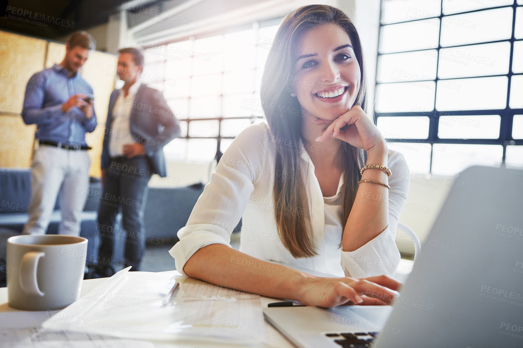 Buy stock photo Shot of a businesswoman using a laptop in an office