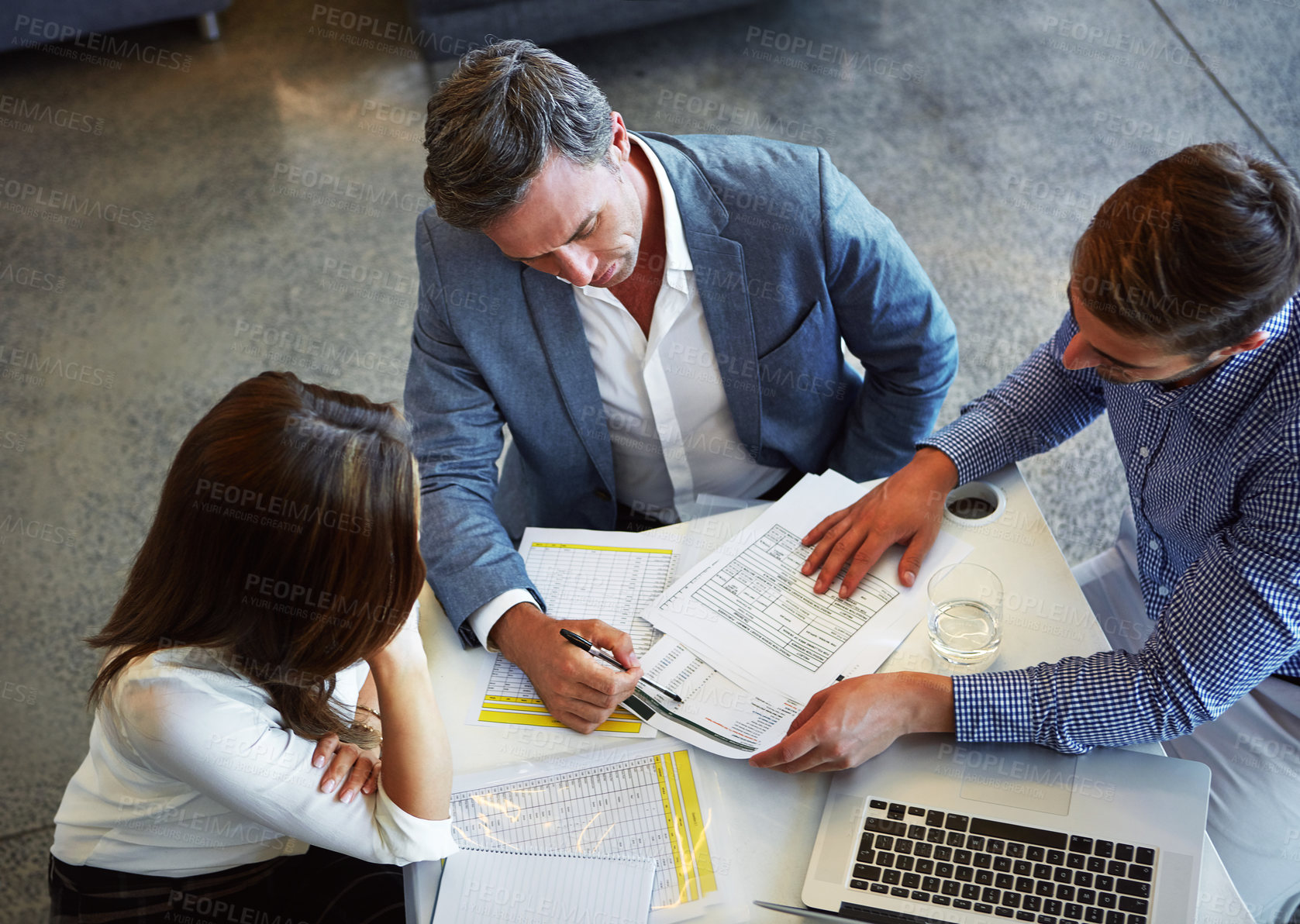 Buy stock photo Top view, business people and employees with documents, planning and collaboration in the workplace. Staff, group or coworkers brainstorming, paperwork or teamwork in a meeting, new project and ideas