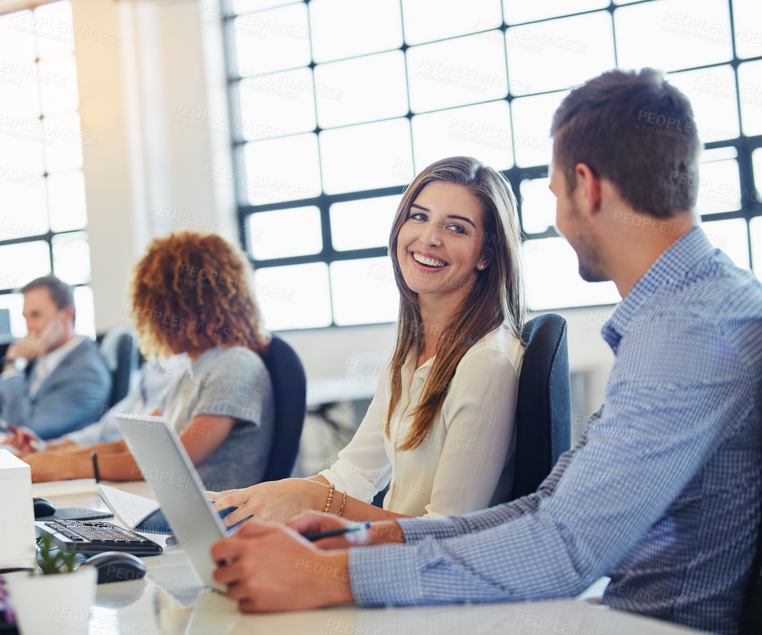 Buy stock photo Cropped shot of a group of businesspeople working in the office