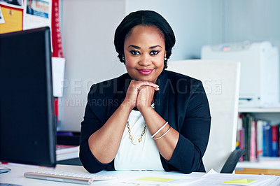 Buy stock photo Portrait of a young businesswoman working at her desk