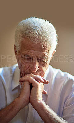 Buy stock photo Cropped shot an elderly man looking worried