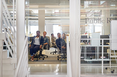 Buy stock photo Portrait of a group of colleagues sitting together in an office